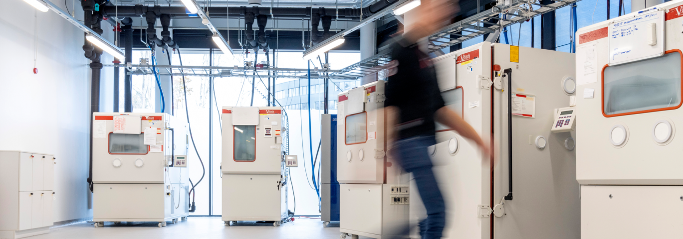 Reliability lab, man walking in environmental lab-1